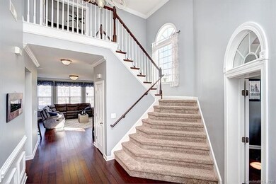 Two story foyer, wood floors throughout first floo