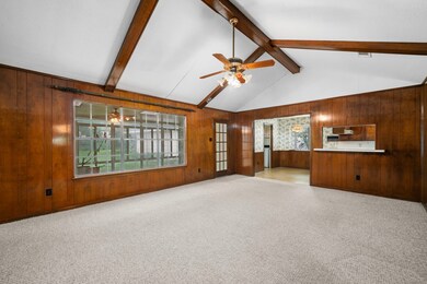 Huge windows and a flexible floor plan - leave as is, or open this space up to the kitchen.