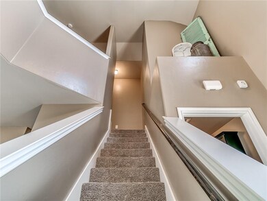 Stairway to bonus room and bedrooms.