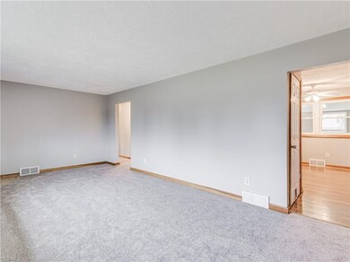 Living room is light and bright and adjacent to th