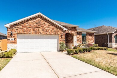 Double wide driveway with 3-car attached garage.