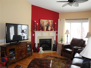 Decorator colors, warm hardwood floors and custom architectural details set this home apart from the others