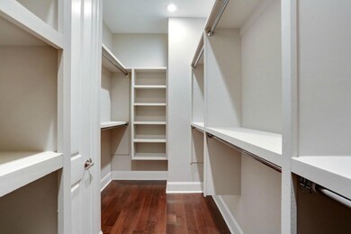 Large walk in master closet with custom design off