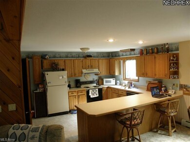 Large kitchen with plenty of cabinets and counter 