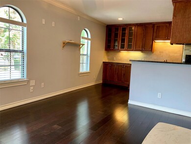 Kitchen featuring dark wood-style flooring, taste