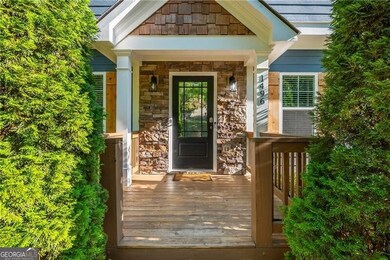 Entrance to property with stone siding