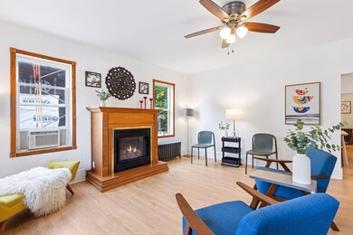 Warm living room with a cozy fireplace.