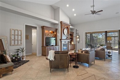 Huge open floor plan with beautiful build in cabinetry, surround sound, ceiling fans and fireplace