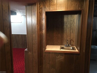 Handy wet bar to service the recreation room.