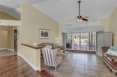Spacious formal living room looking out at the poo