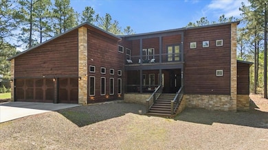 Contemporary home with driveway and a balcony