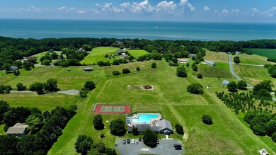 Aerial view of community center, pool and tennis c