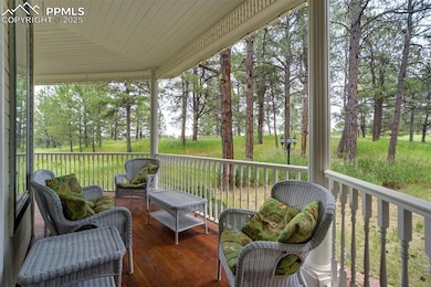 Covered front porch with ample room for seating and hot tub
