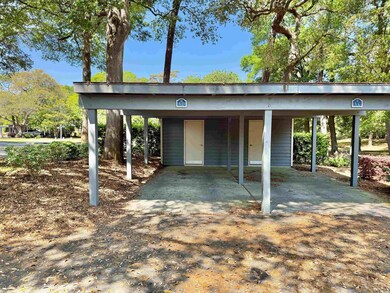 View of parking with a carport