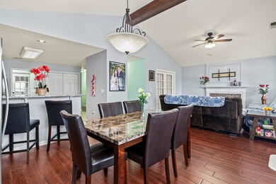 Dining room featuring vaulted ceiling with beams, 