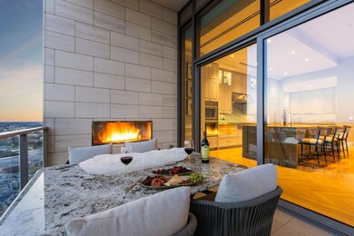 Dine alfresco by the fireplace located off the kit