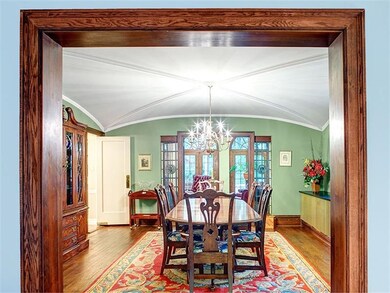 The dining room has a beautiful vaulted ceiling, a
