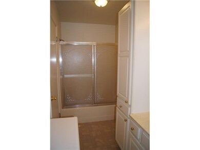 Full Bath. The full bath features white cabinets!