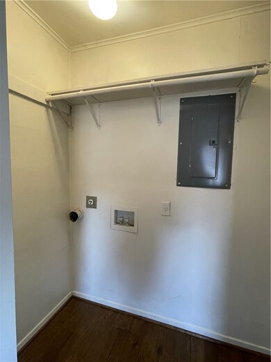 Laundry room with washer hookup, dark wood-style f