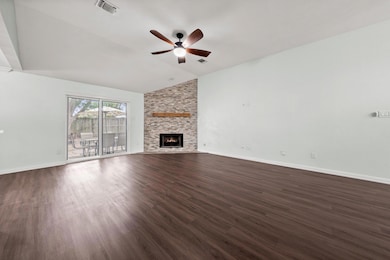 Unfurnished living room featuring a ceiling fan, 