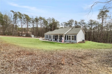 View of front of property with a front lawn and co