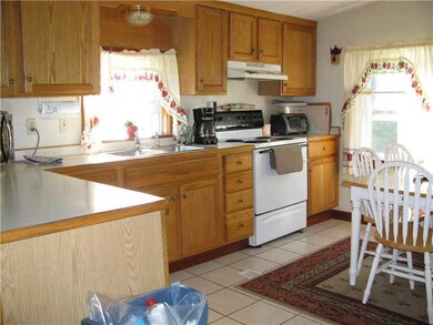 Kitchen. NEWER OAK KIT. TILE FLOORING