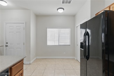 Kitchen featuring light countertops, visible vents