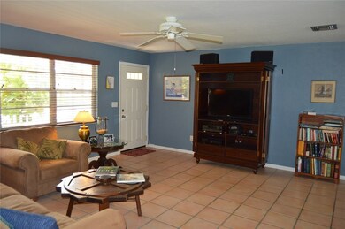 VIEW OF NICE TILED LIVING ROOM.