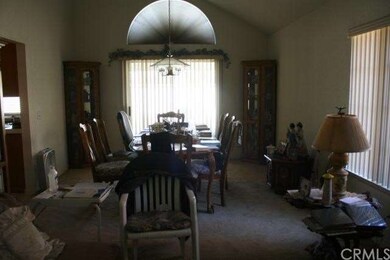 Dining room, kitchen on left, slider doors exit to
