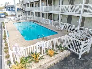 Pool featuring a patio area and fence