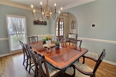 Dining area featuring crown molding, visible vents