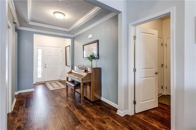 Spacious foyer with tray ceiling