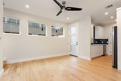 Empty room featuring light wood-type flooring, a 