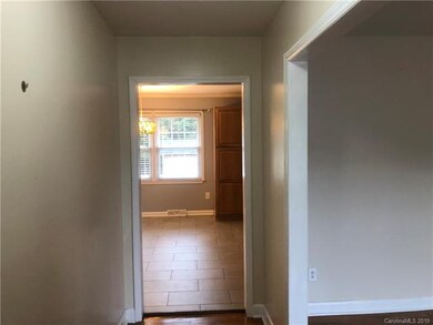 Entryway with living room on the right eat in kitc