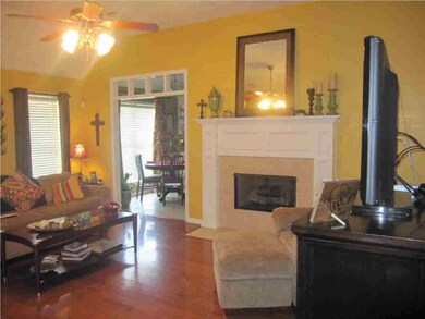 LIVING ROOM WITH GAS LOG FIREPLACE.