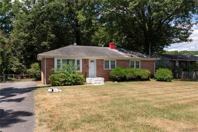Single story home with a front lawn