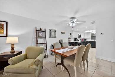 Dining space featuring light tile patterned flooring and a ceiling fan