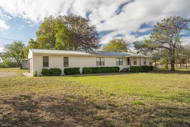 Ranch-style house with a front lawn
