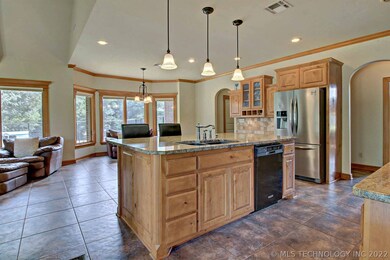 Beautiful tile flooring throughout kitchen, den, h