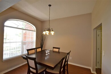 Formal Dining with large arched window