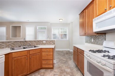 Kitchen--new flooring, gas range with electric ove