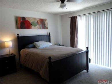 Master bedroom with slider leading to the back yar