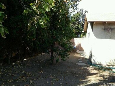 Fruit tree, block walls in backyard
