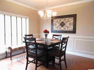 Formal dining bathed in light.