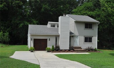 Additional parking pad along with long driveway al