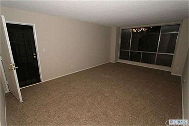 Living Room with new carpet and paint.  Add furnit