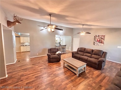 Living area with view to kitchen, dinning, utility