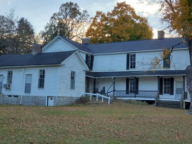 Another View of the Back of the House showing the Covered Back Porch. 