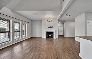 Living area with fireplace and large open windows 