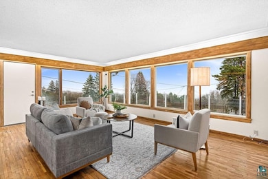 Living area featuring crown molding, baseboards, l